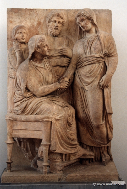 6234.jpg - 6234: Grave stele in the form of a temple representing a dexiosis (handshake), ca. 340 BC. From Athens. National Archaeological Museum, Athens.