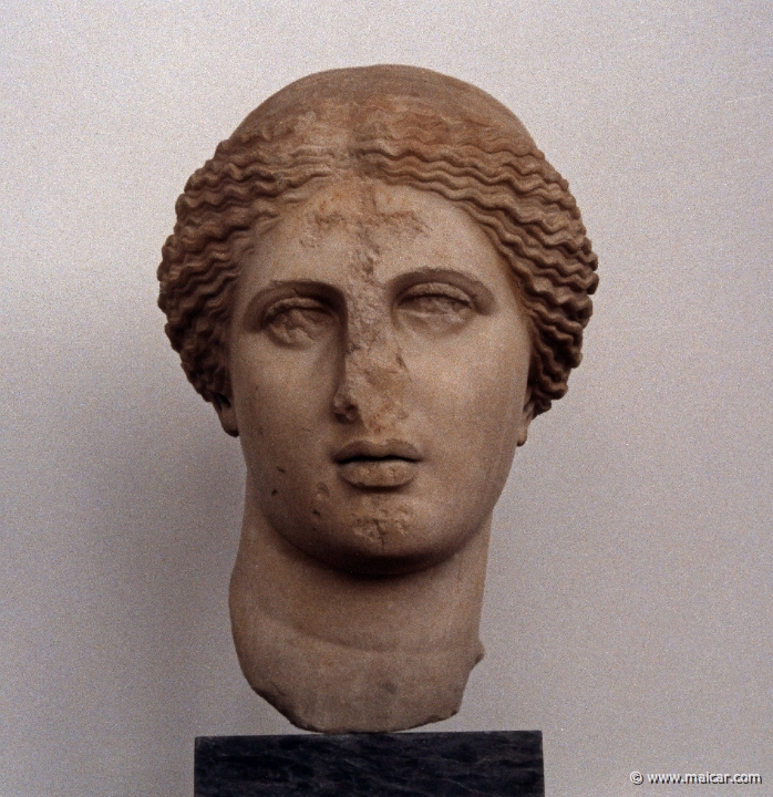 6228.jpg - 6228: Head of Aphrodite. Roman copy of a Praxitelian original of the 4C BC. The first Christians incised two crosses on the forehead and chin of the statue of the goddess. Found at the Roman Agora of Athens (by the so called Tower of the Winds), 2C AD. National Archaeological Museum, Athens.
