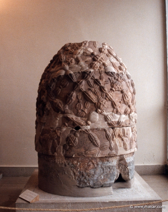 5931.jpg - 5931: Copy of the famous Delphic omphalos that was kept in the adyton of the Temple of Apollo. Its surface is covered with a net of woolen bands. It was the symbol of Delphi which signifies the belief that Delphi was the centre of the world. Archaeological Museum, Delphi.