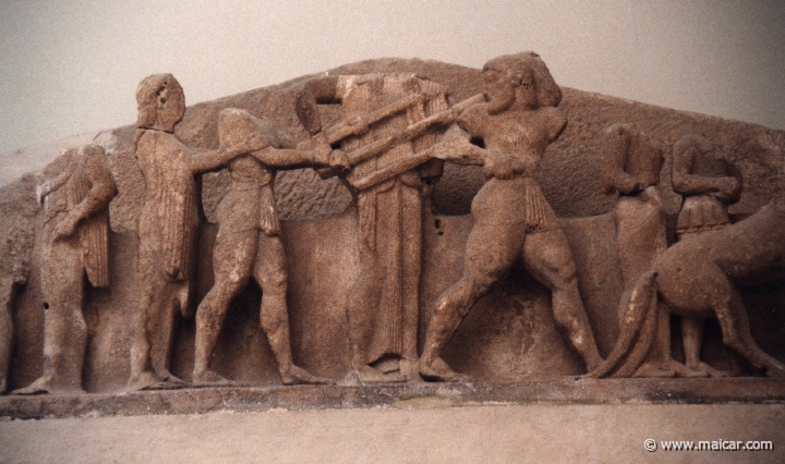 6025.jpg - East pediment of the treasury of Siphnos (525 BC). Apollo and Heracles disputing about the Delphic tripod. Archaeological Museum, Delphi.