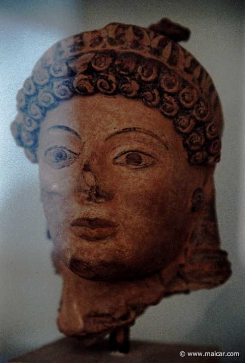 6733.jpg - 6733: Terracotta head of Athena, ca. 490 BC. Archaeological Museum, Olympia.