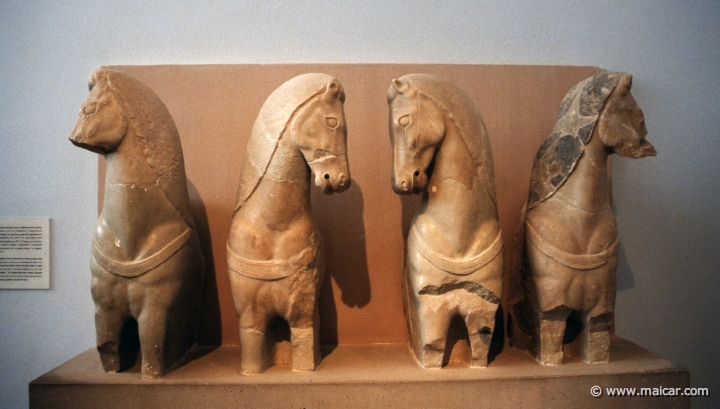6414.jpg - 6414: Around 570 BC. Foreparts of four horses from a chariot group. Hymettian marble. Acropolis Museum, Athens.