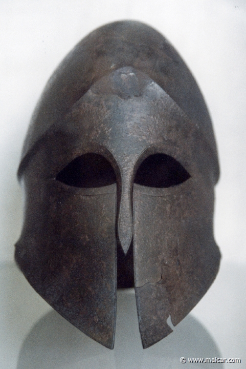 6617.jpg - 6617: Bronze helmet. Corinthian. Early 5C BC. Archaeological Museum, Corinth.