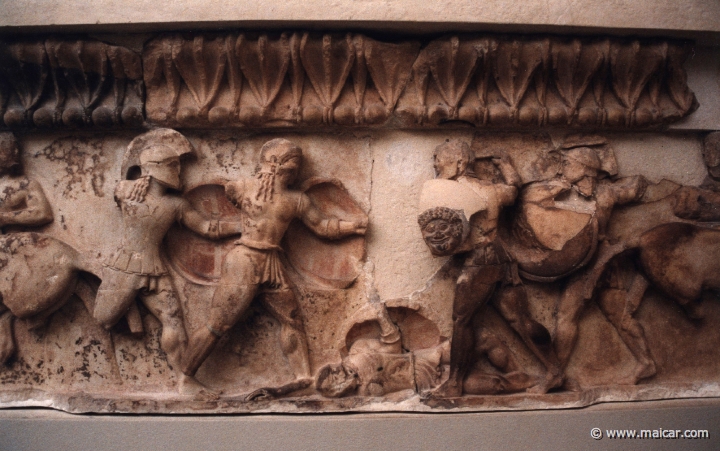 6024.jpg - 6024: Frieze of the treasury of Siphnos (525 BC): Greeks and Trojans fighting over a dead hero. Archaeological Museum, Delphi.