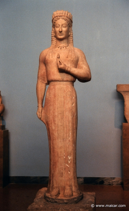 6126.jpg - 6126: Statue of a Kore. Parian marble. Found in Merenda (ancient Myrrhinous), Attica. Made by the sculptor Aristion from Paros. 550-540 BC. National Archaeological Museum, Athens.