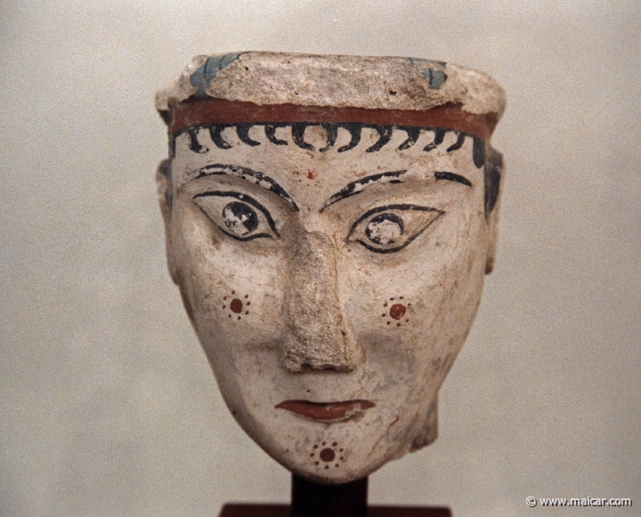 6331.jpg - 6331: Head of Sphinx in lime-plaster; rare example of Mycenaean sulpture in the round (?) with painted details. It was found in a house southeast of the Grave Circle of the Acropolis at Mycenae. 13C BC. National Archaeological Museum, Athens.