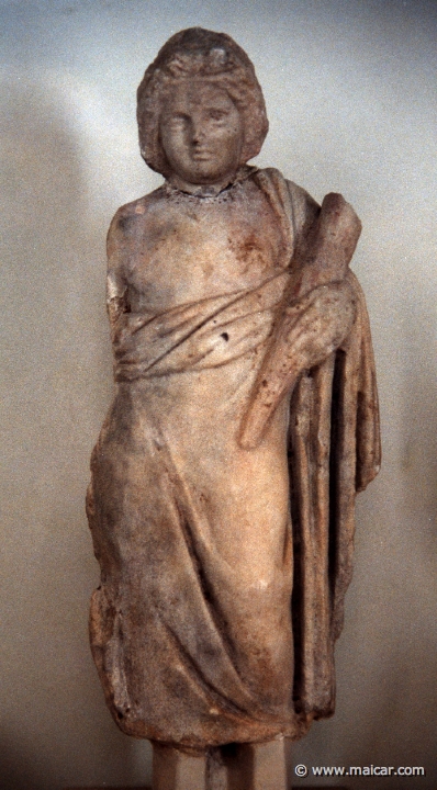 6511.jpg - 6511: Statuette of an initiate holding a torch. Archaeological Museum of Eleusis.