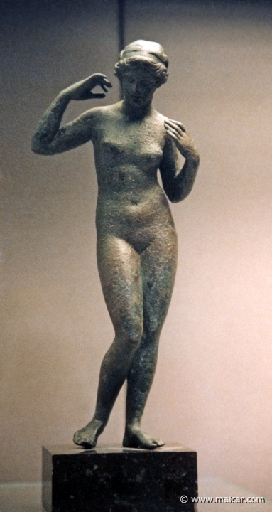 8406.jpg - 8406: Bronze statuette of Aphrodite tying a necklace, a type known as the Aphrodite Pselioumene, 200-100 BC. British Museum, London.